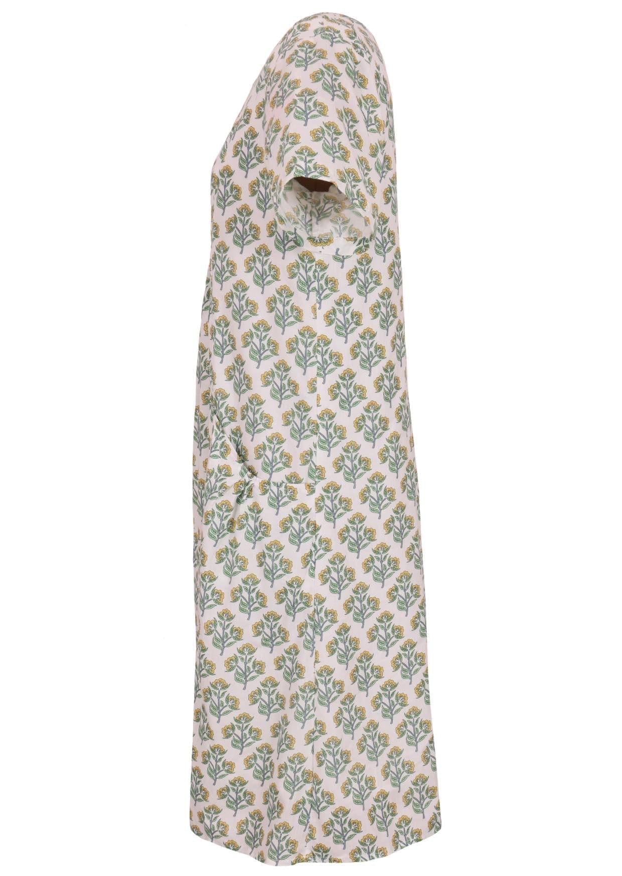 The side of the dress has a floral pattern, on white cotton