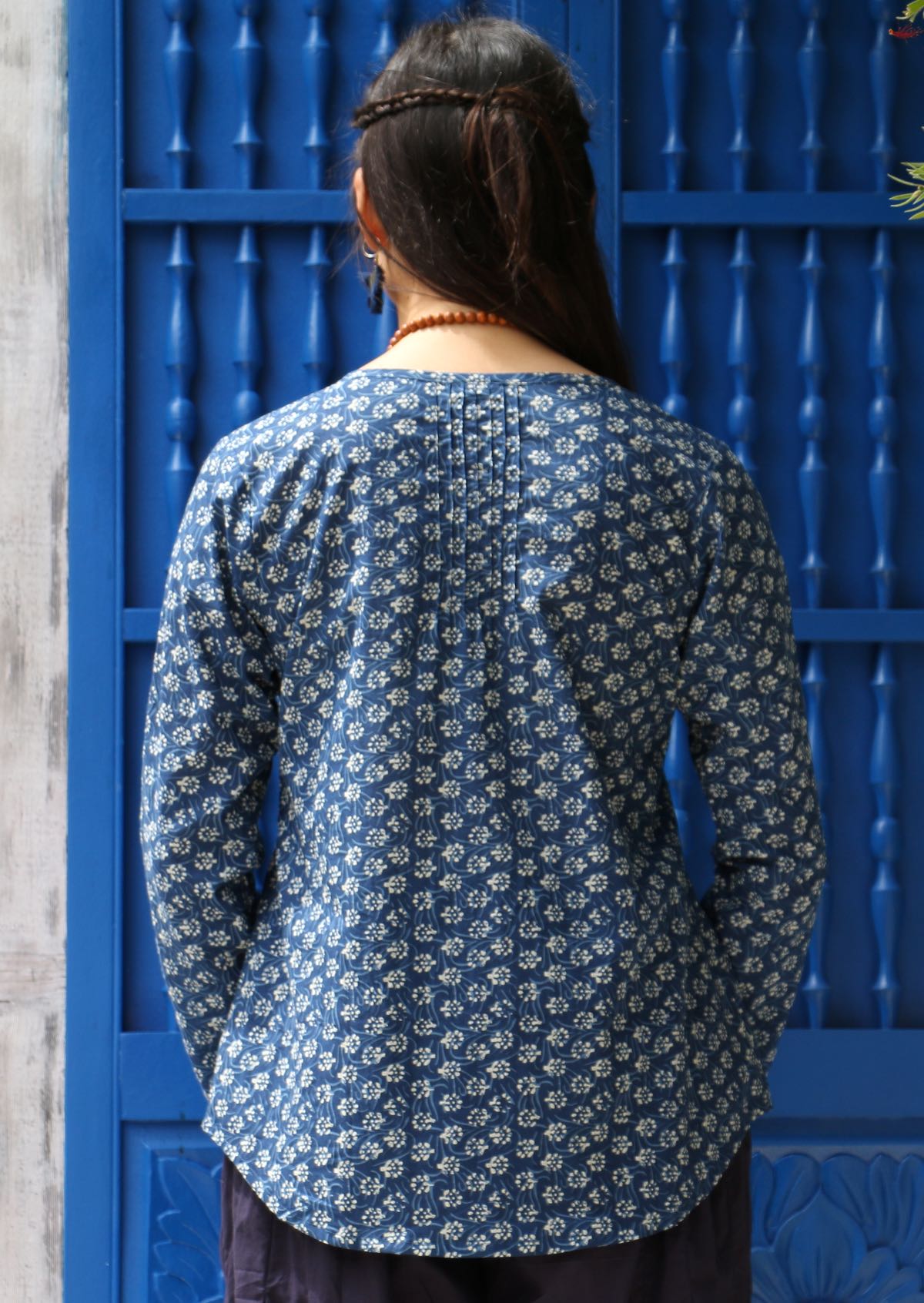 Small pleats in the centre back creates interest and texture