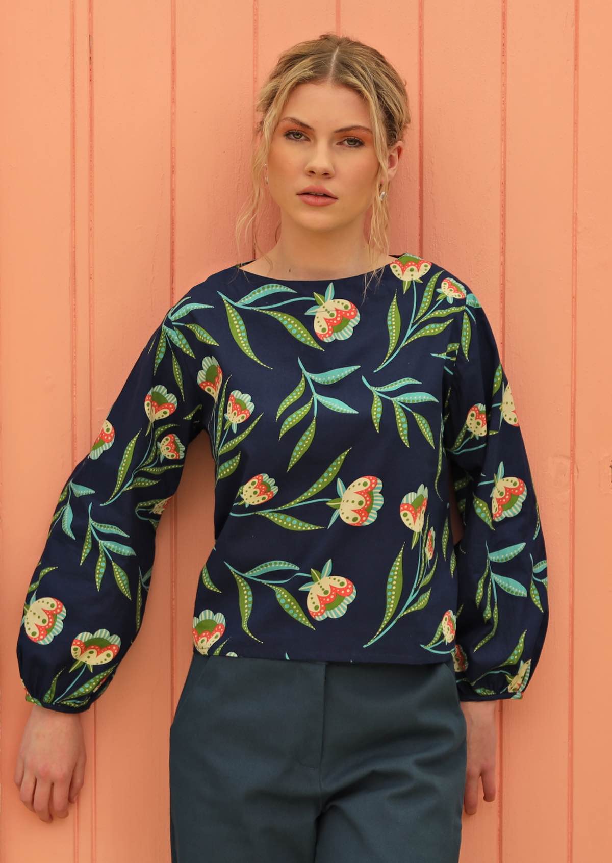 Model wears long sleeve top.