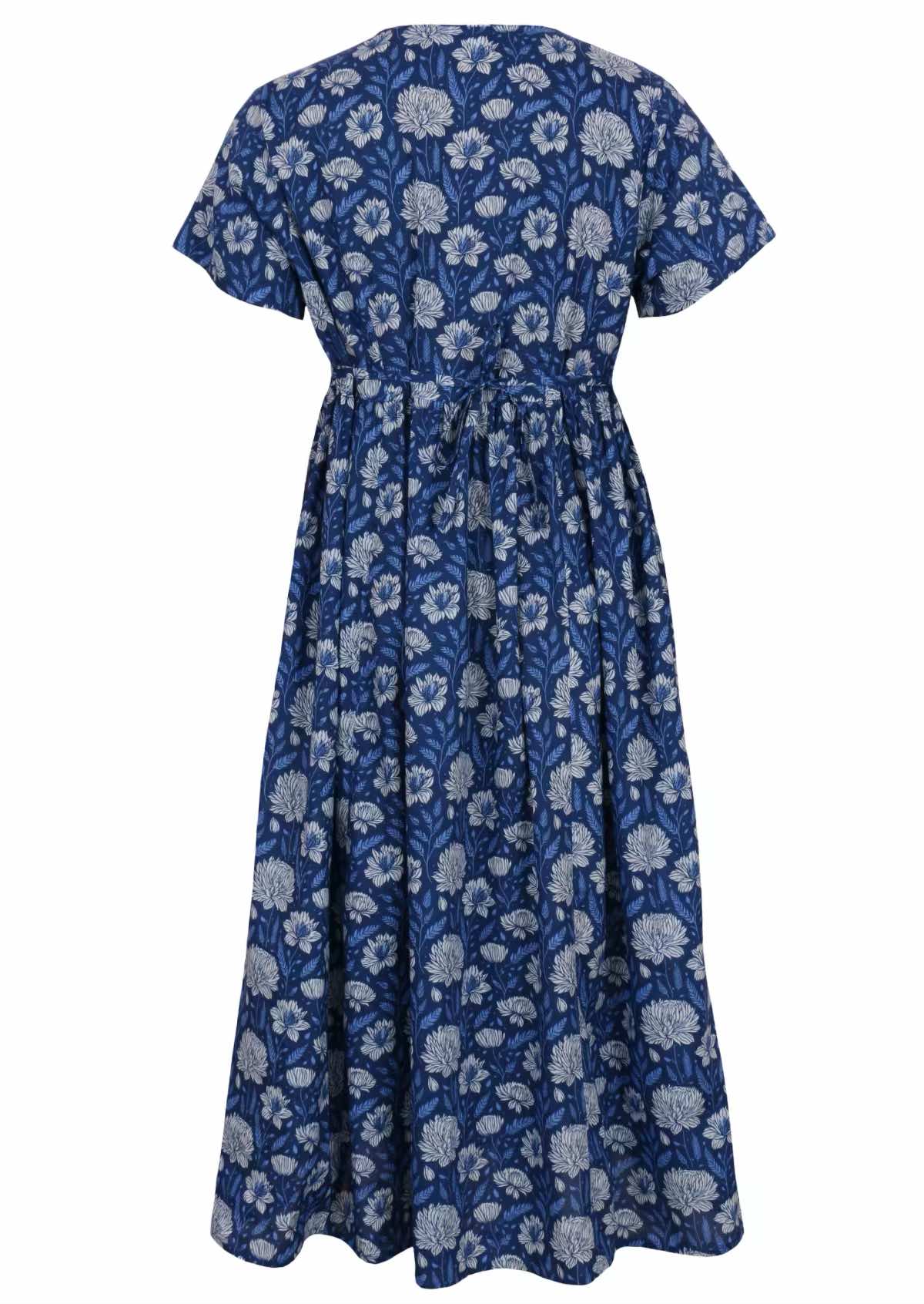 100 percent cotton navy blue button through v-neck dress with pockets and shoestring tie at the back. back view of dress