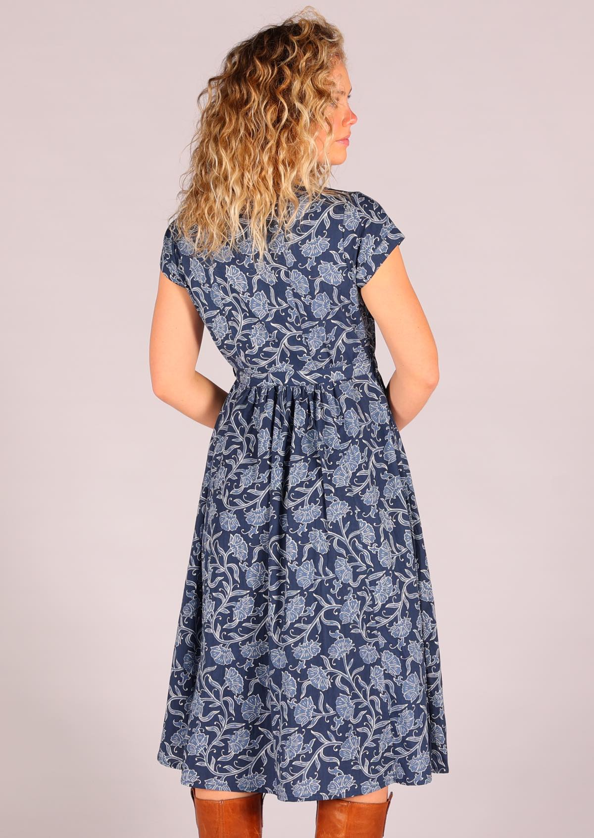 Woman modelling back of 100 percent cotton Navy blue retro shirt dress