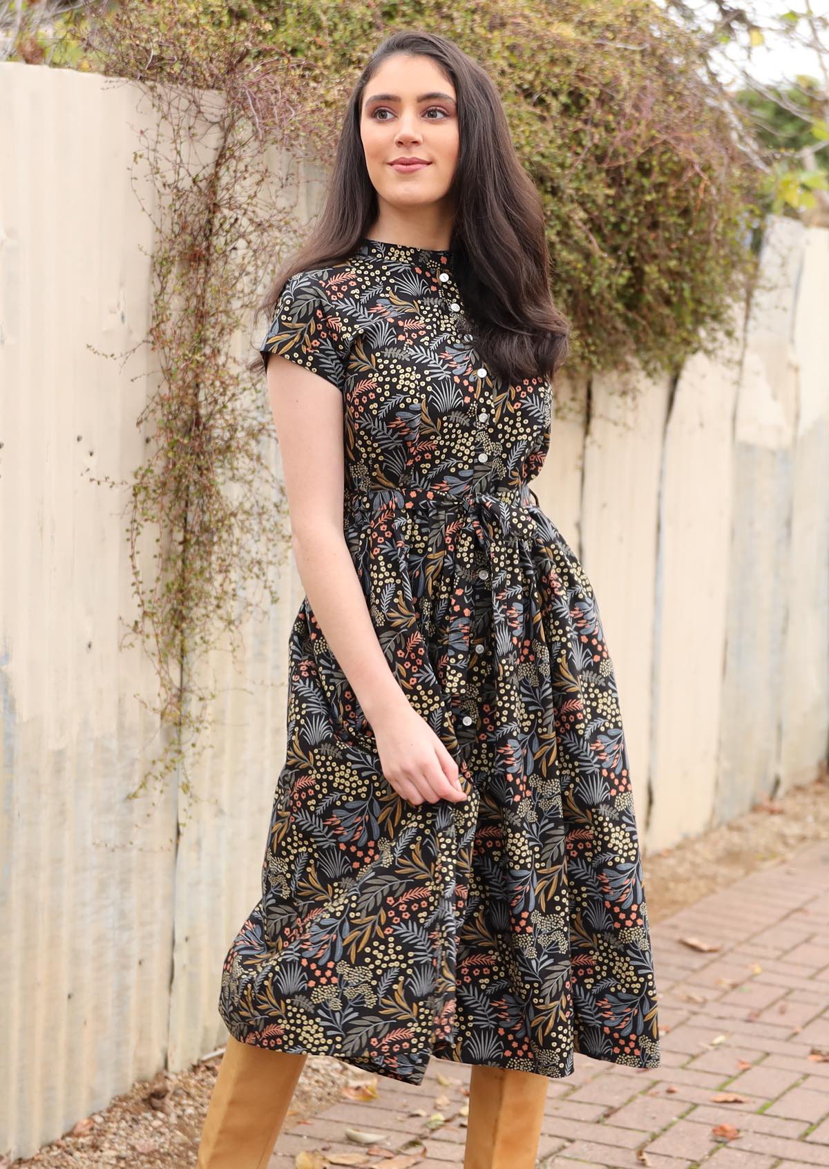 100% cotton botanical print on black base dress with waist tie