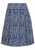 100% cotton above knee skirt with piped details, pockets and beautiful white florals on blue base.