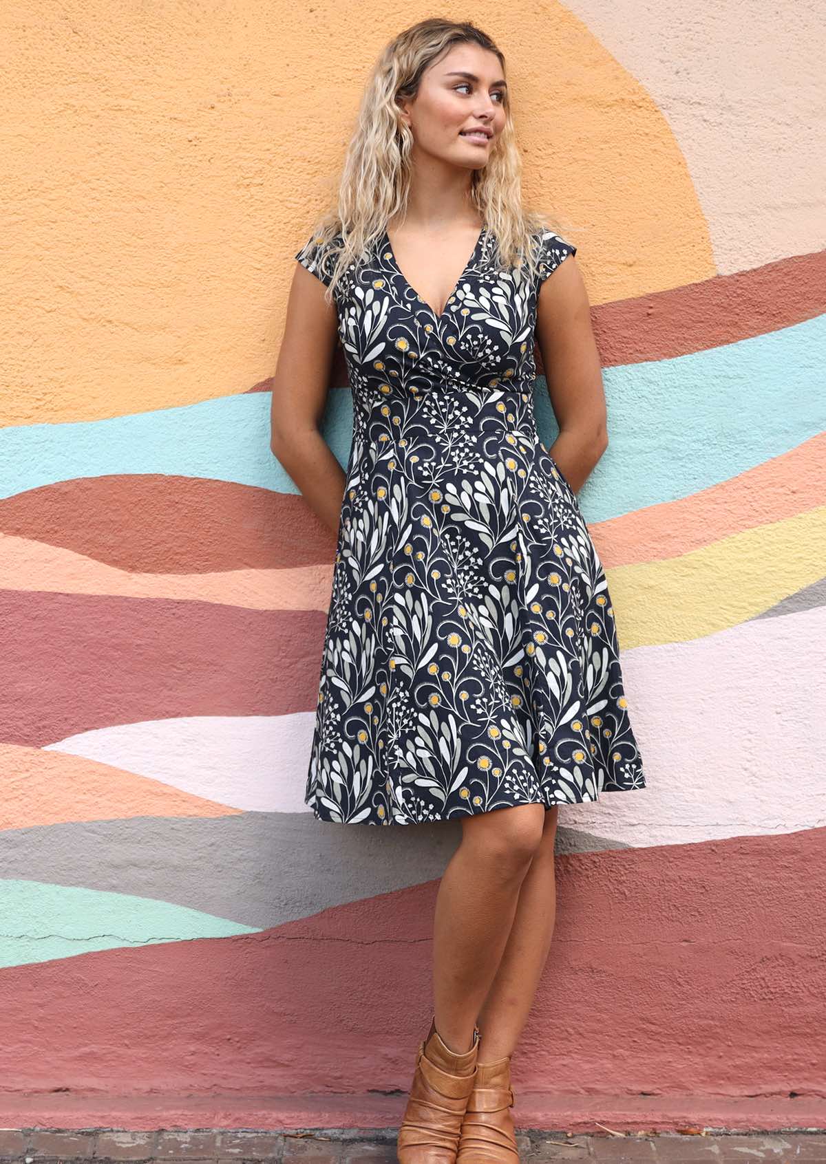 Strike a pose in this retro inspired cotton dress with cap sleeves, V-neckline, fuller skirt and pockets