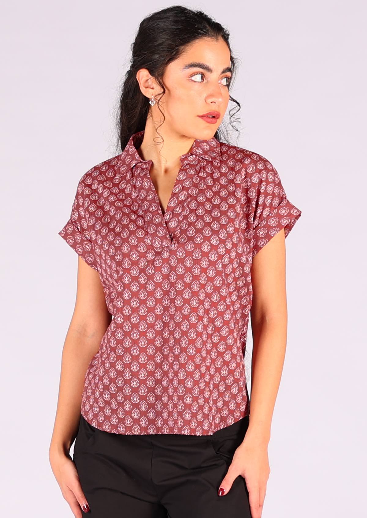 Model styles dark terracotta 100% cotton top with black pants. 