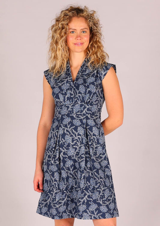 Model wearing navy blue based floral cotton retro style dress 