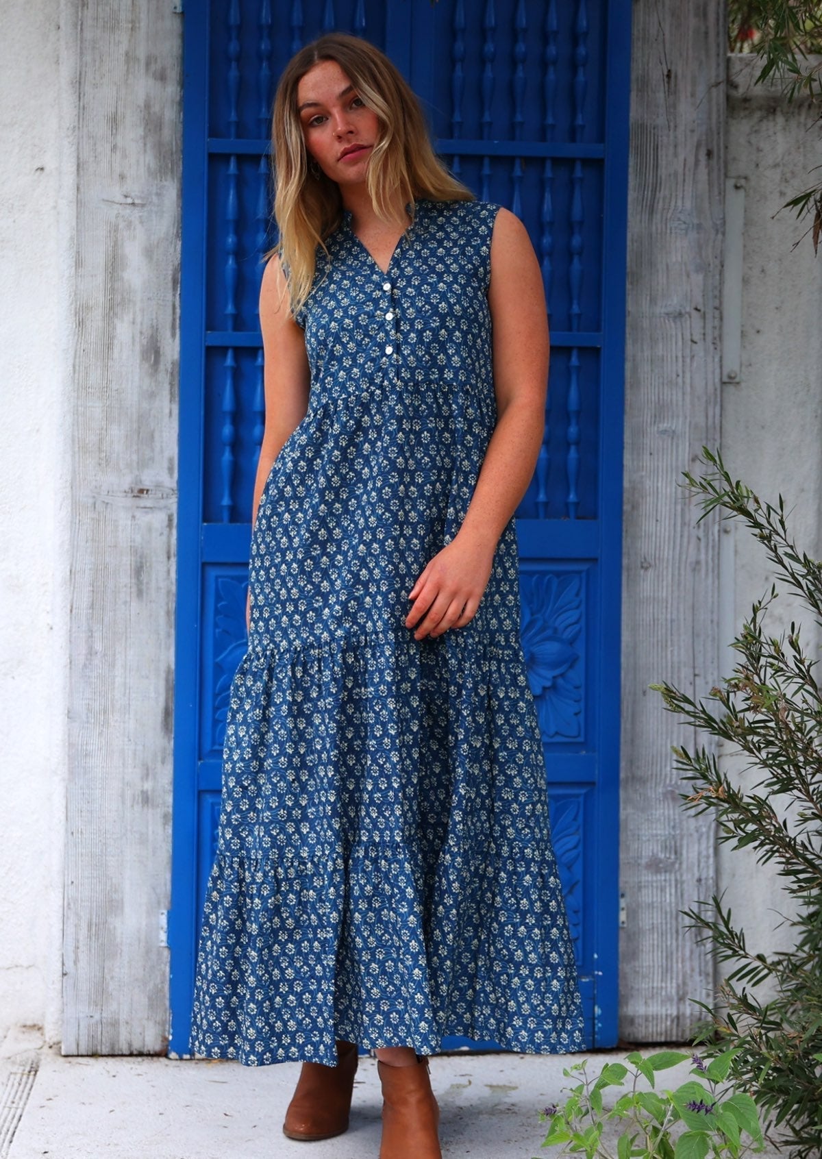 Sleeveless cotton maxi dress with three tiered skirt and hidden side pockets