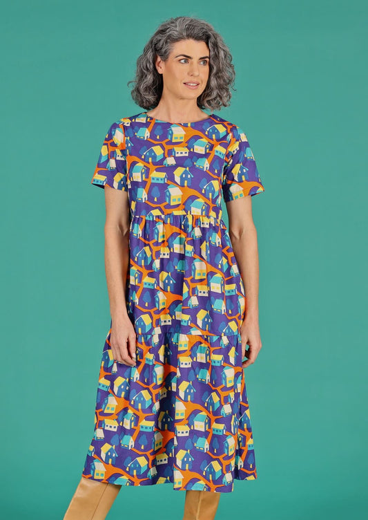 Claudia Dress Around the Houses orange blue yellow house print cotton maxi dress empire waistline and hidden pockets | Karma East Australia