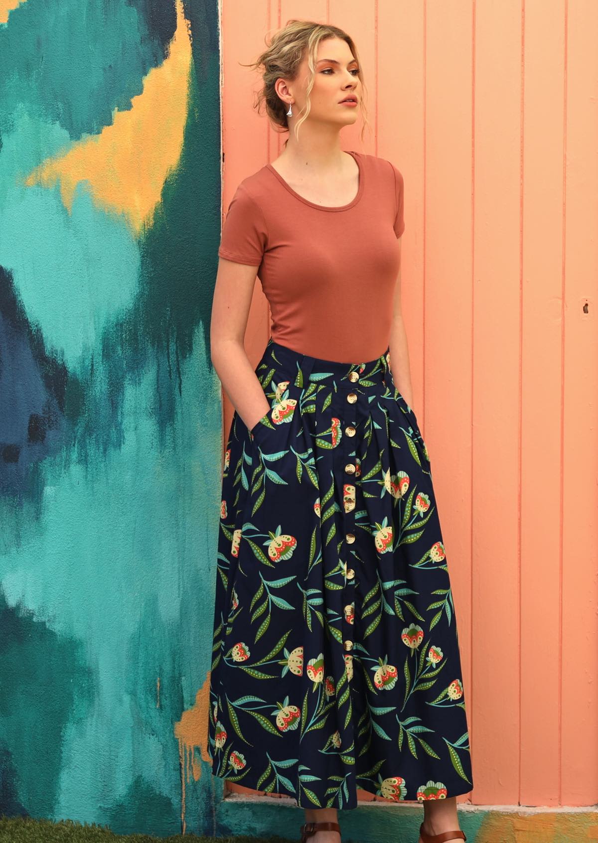 Model wears blue cotton button through skirt