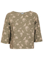Front mannequin photo of cotton 3/4 sleeve boxy top in pale green based floral print