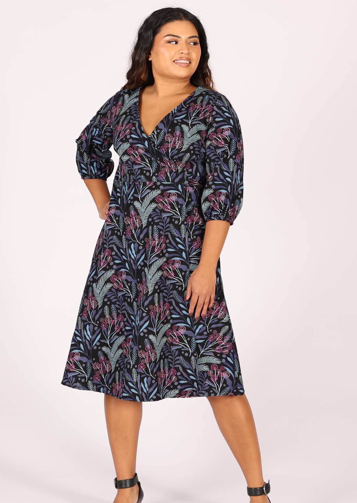 Wrap dress forms a V-neckline and A-line skirt