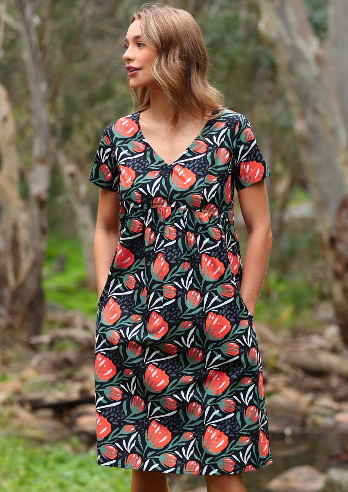 Striking botanical print with black base cotton short sleeve dress with deep pockets