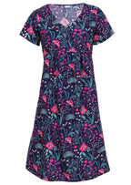 100 percent cotton v-neck empire waist sundress with hot pink and bright purple flowers on a deep blue base with pockets 