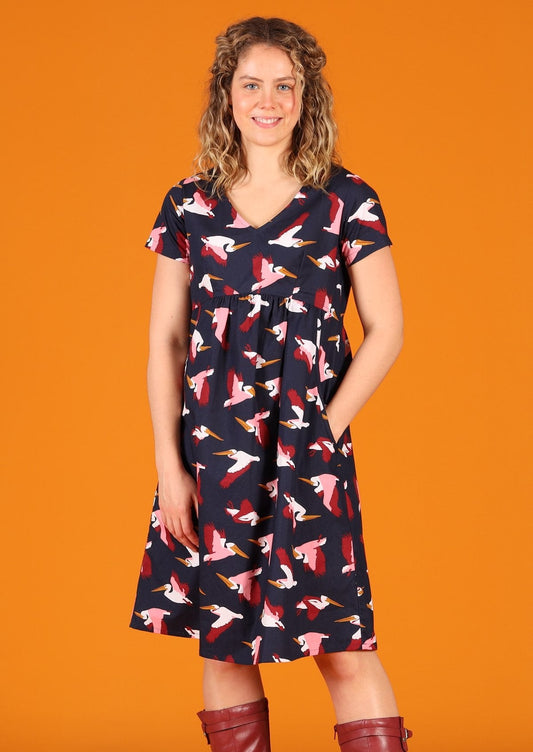 Etta Dress Percival 100% cotton pelican print on dark blue base short sleeve v-neck knee length dress with side pockets | Karma East Australia 