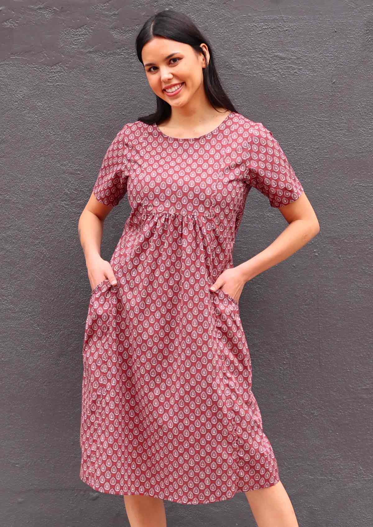 Model with her hands in pockets wearing short sleeve cotton sundress 