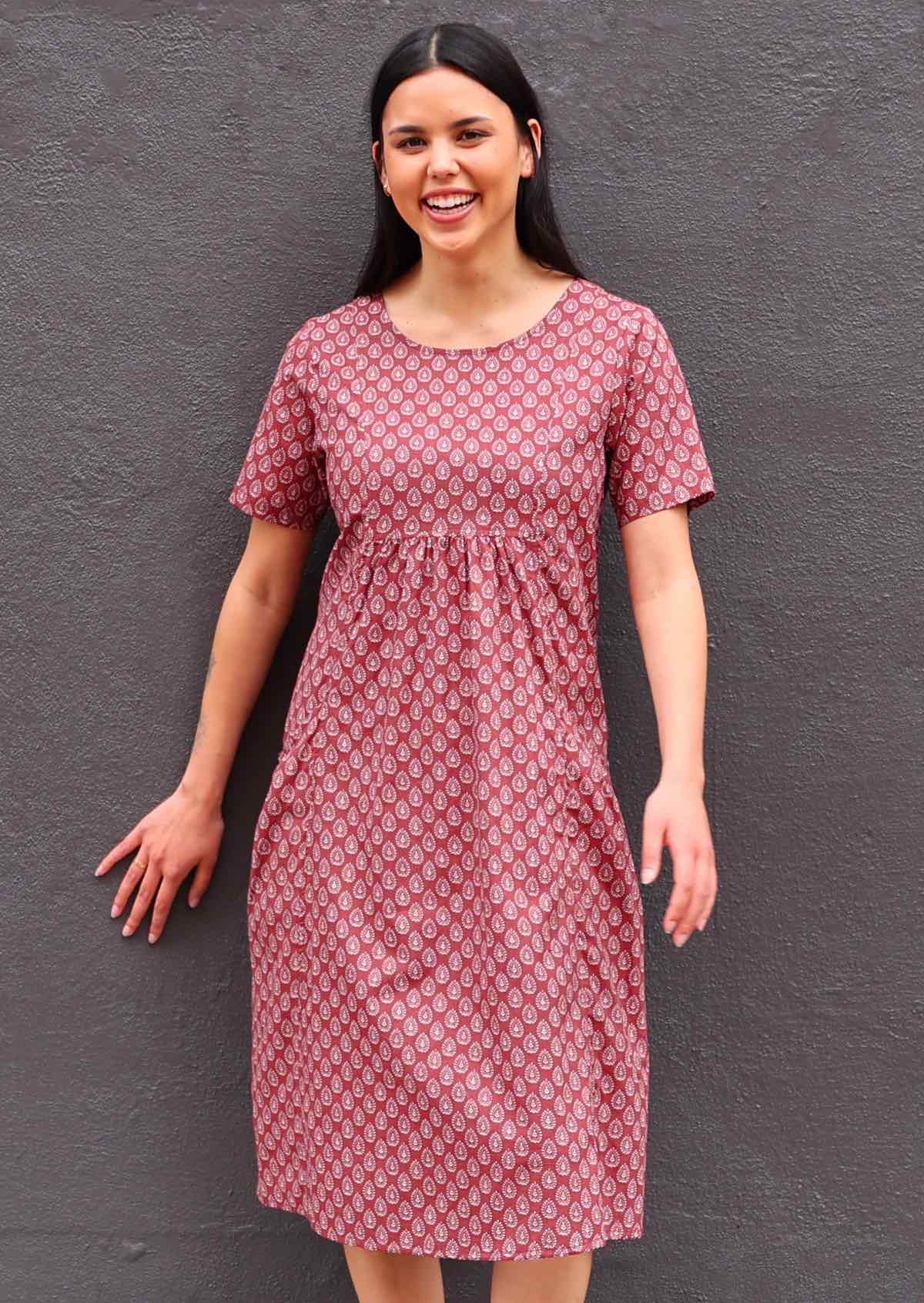 Model standing wearing short sleeve cotton sundress