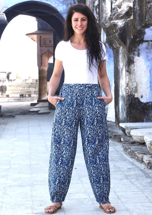 Woman standing with hands in pockets wearing blue Indian 100% cotton pants