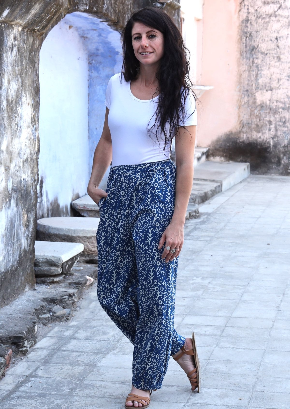 Woman standing with one hand in pocket wearing blue Indian 100% cotton pants