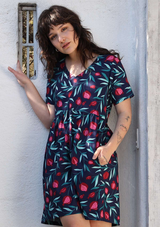 Model wears 100% cotton fruit print dress.