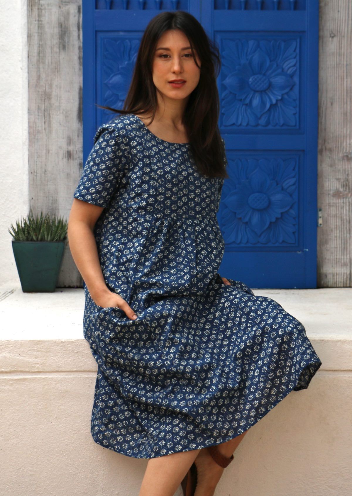 100% cotton dress with sweet small white flower print on blue base 