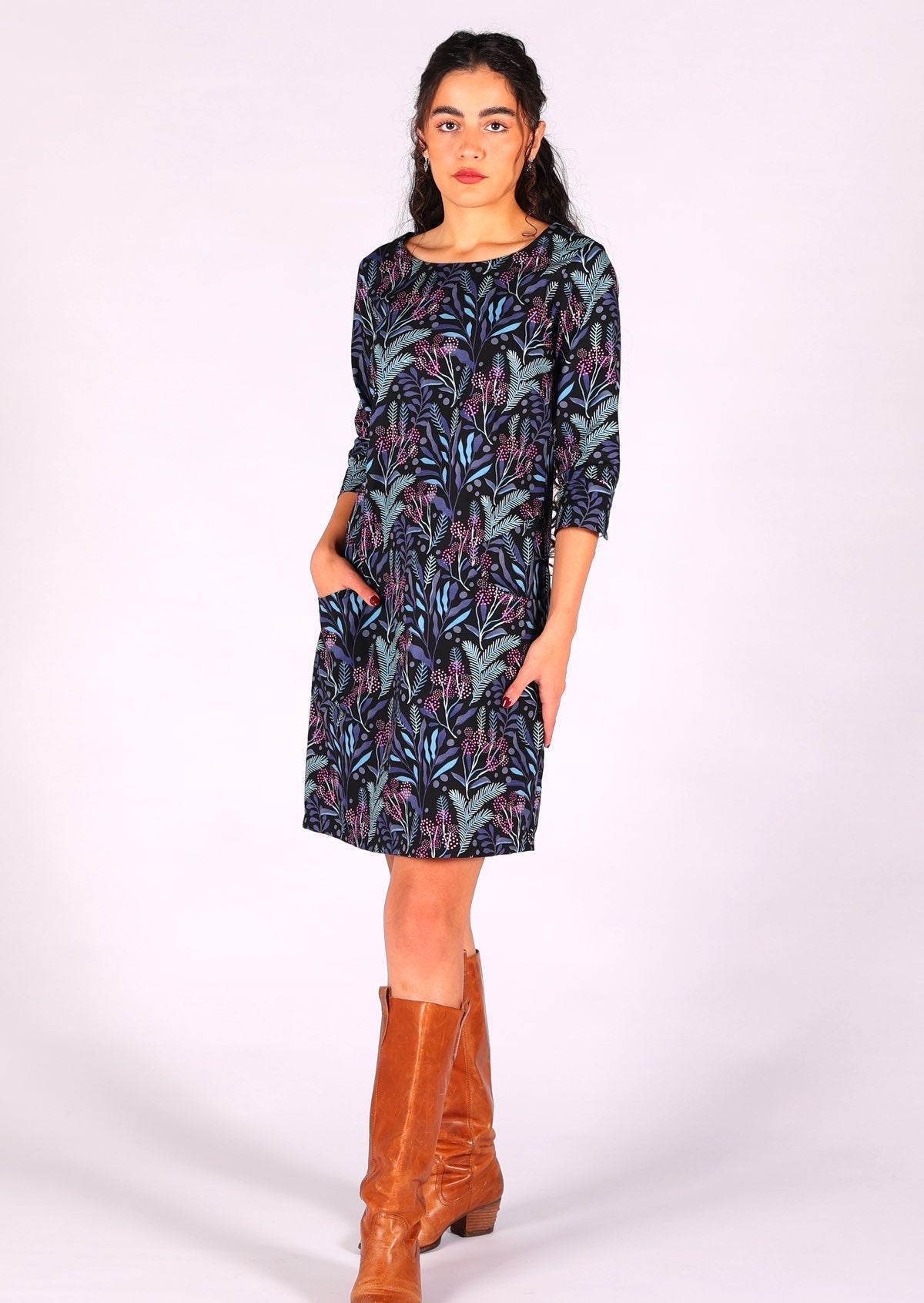 Above knee cotton dress with 3/4 sleeves in a striking botanical print on black base