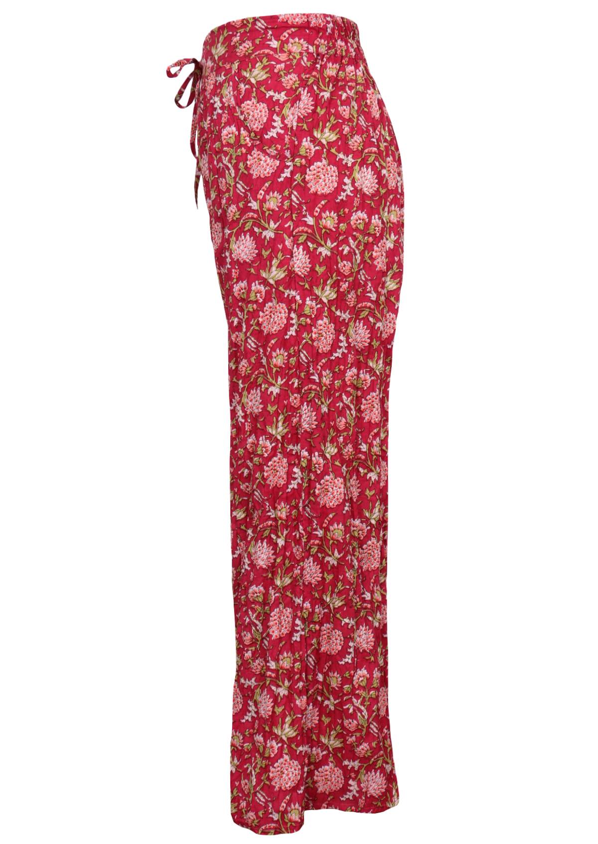 Side mannequin photo of cotton wide leg high waisted floral print pants with drawstring and pockets