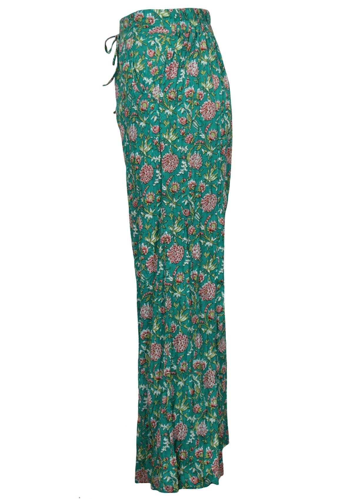 Side mannequin photo of floral print wide leg cotton pants with pockets and drawstring