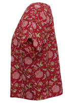 Side mannequin photo of cotton short sleeve relaxed fit top in floral print on bright red base
