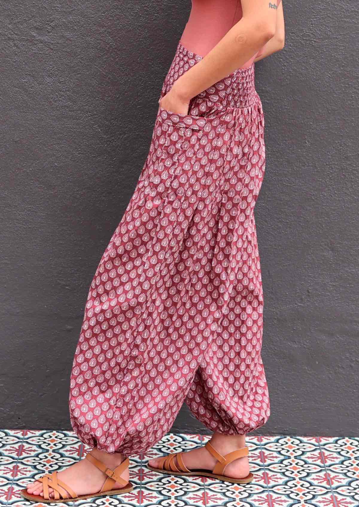 Model wearing 100 percent cotton harem pants with hands in pockets