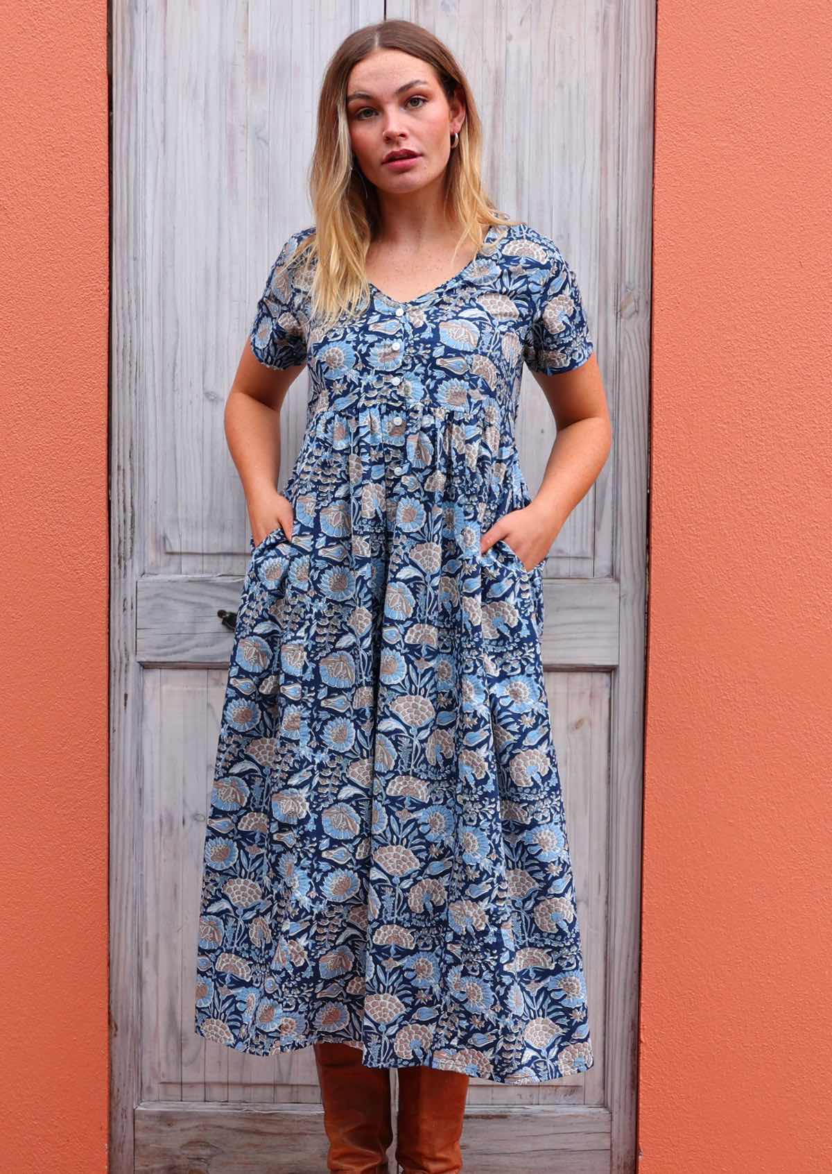 Loose fit cotton dress with short sleeves and V-neck has pockets