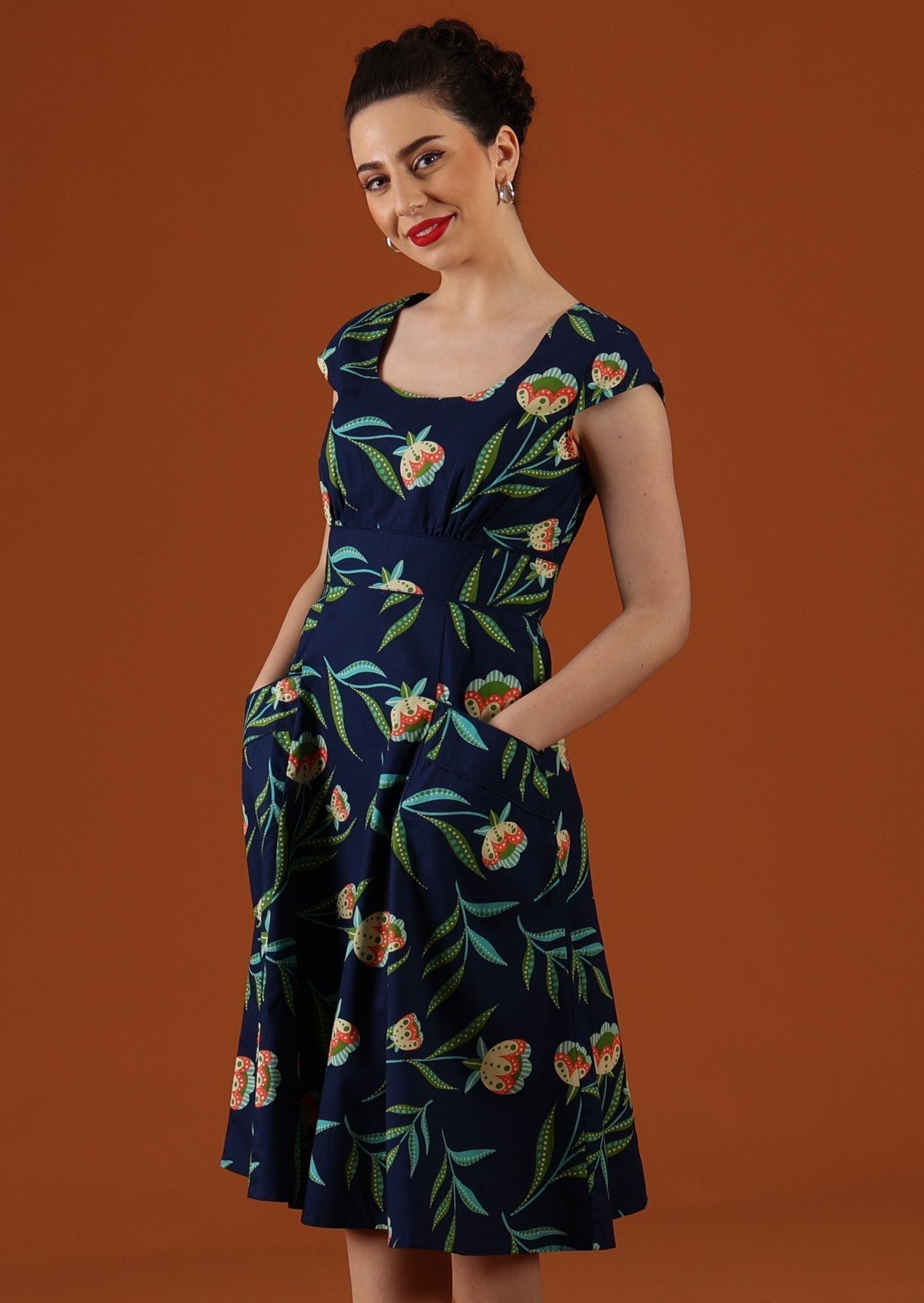 Model wears 100% cotton retro dress. 