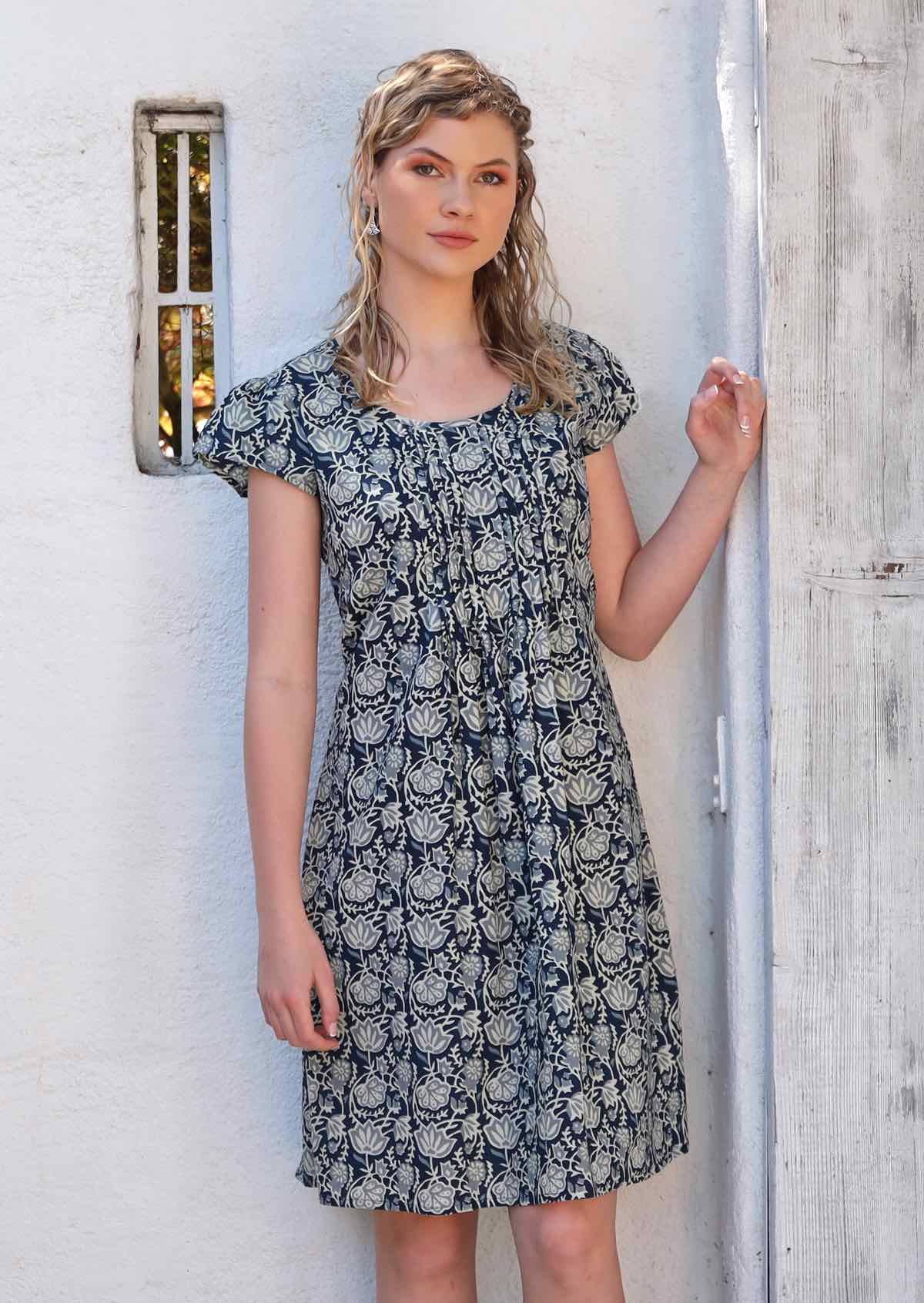 Model wears fully lined 100% cotton dress. 