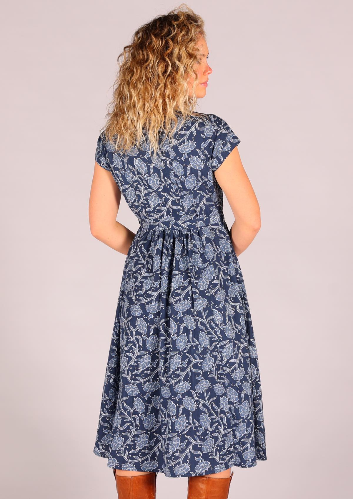 Woman modelling back of 100 percent cotton Navy blue retro shirt dress  