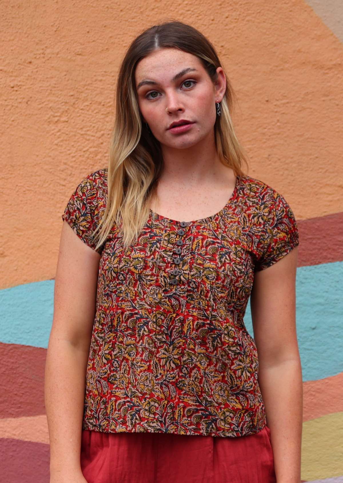 Model wearing 100 percent cotton Indian block print blouse with buttons