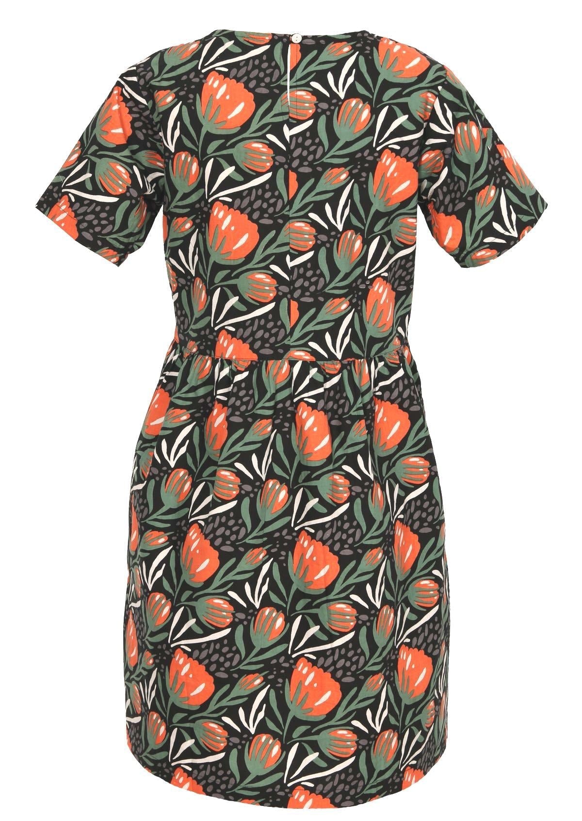 Striking red and green botanical print on a black base make this dress stand out