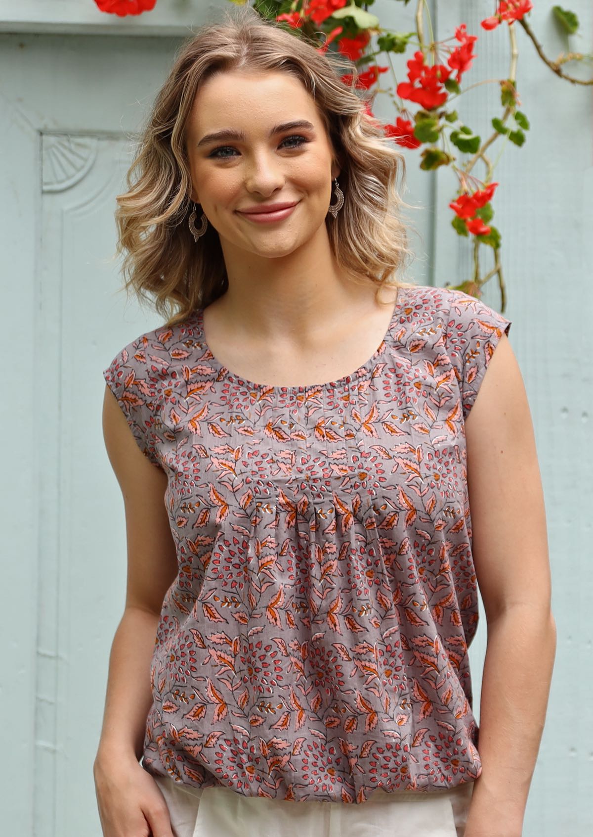 Deja Top cap sleeve round neckline pleats off neckline elasticated bottom front hem sits gathered at hips 100% cotton light purple and pink floral | Karma East Australia