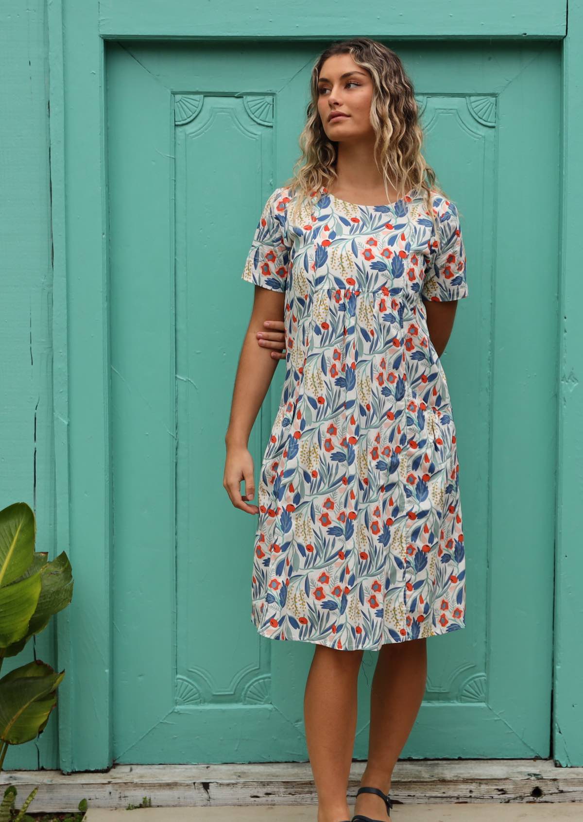 Model wears 100% cotton, fully lined knee length dress. 