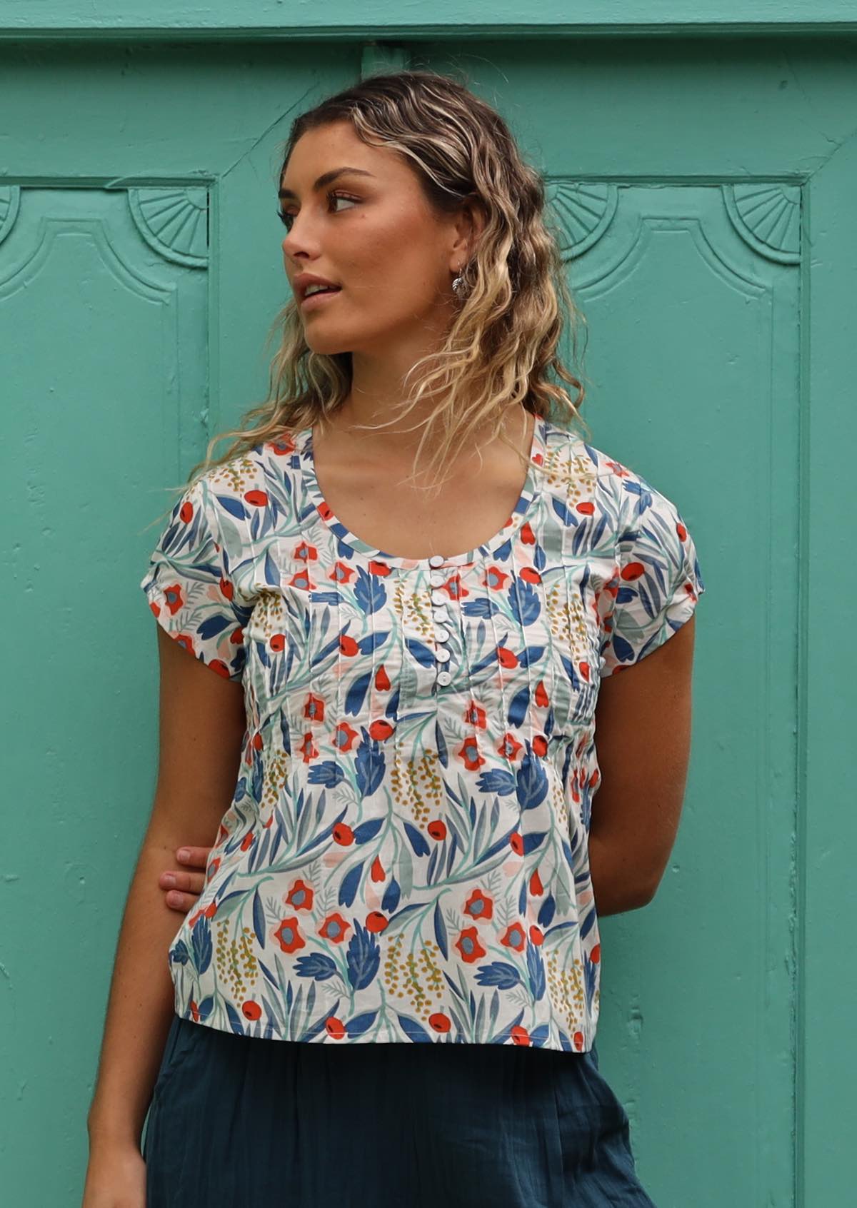 Model wears white base cotton top with sweet floral print